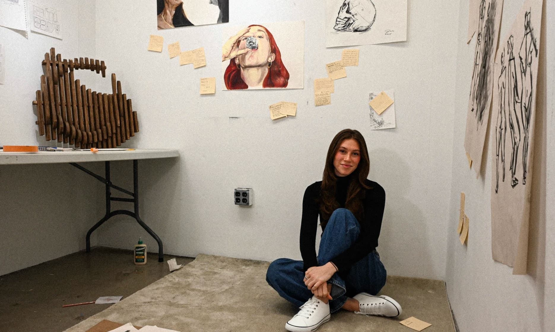 Jaime Salmonson seated in an art studio